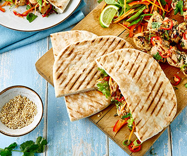 Warburtons Barbecued sesame chicken skewers with crispy vegetables in a White Pitta
